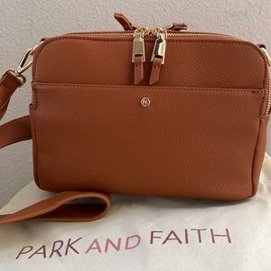 New. Never carried Park and Faith crossbody purse.
